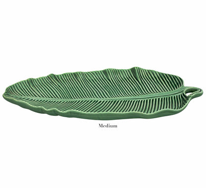 The HIVE Banana Leaves Platter Collection features a medium ceramic handmade platter with detailed banana leaf ridges, showcased on a plain white background.