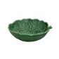 The Hive Geranium Leaf Serveware Collection features a green ceramic bowl shaped like a leaf, complete with vein patterns and a small handle—perfect for adding nature-inspired charm to your tableware.
