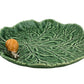 Shaped and textured like a green leaf with a ceramic snail on the rim, this piece from Hive’s Geranium Leaf Serveware Collection is ideal for anyone who enjoys nature-inspired tableware.