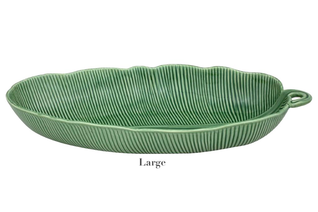 Handcrafted in Portugal as part of HIVE's Banana Leaves Salad Bowl Collection, this large ceramic serving platter features a green, ribbed, leaf-shaped design with a small handle on one end.