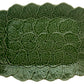 The Hive Geranium Leaf Serveware Collection features a rectangular ceramic platter with a textured green leaf design, bringing nature-inspired elegance and charm to any table setting.