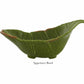 A green ceramic appetizer bowl shaped like a banana leaf with a curved edge, from the Bananas From Madeira Serveware Collection by Bordallo Pinheiro. "Appetizer Bowl" appears below the image.