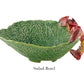 The HIVE Cabbage with Lobsters Serveware Collection features a handmade ceramic salad bowl shaped like cabbage, with a red and yellow lobster handle, inspired by Bordallo designs—perfect for adding charm to any table setting.