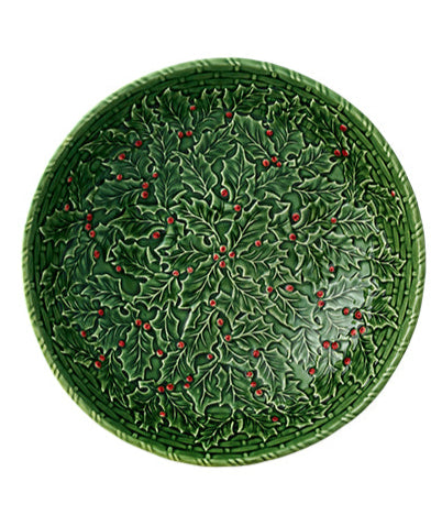 Part of Hive's Holly Serveware Collection, this handmade round plate features green earthenware with raised holly leaves and red berries for a festive holiday touch.