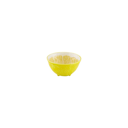The Lemon Collection by Bordallo Pinheiro features a small, round yellow ceramic bowl with a textured pattern and white interior, evoking whimsical tableware and shown centered on a white background.