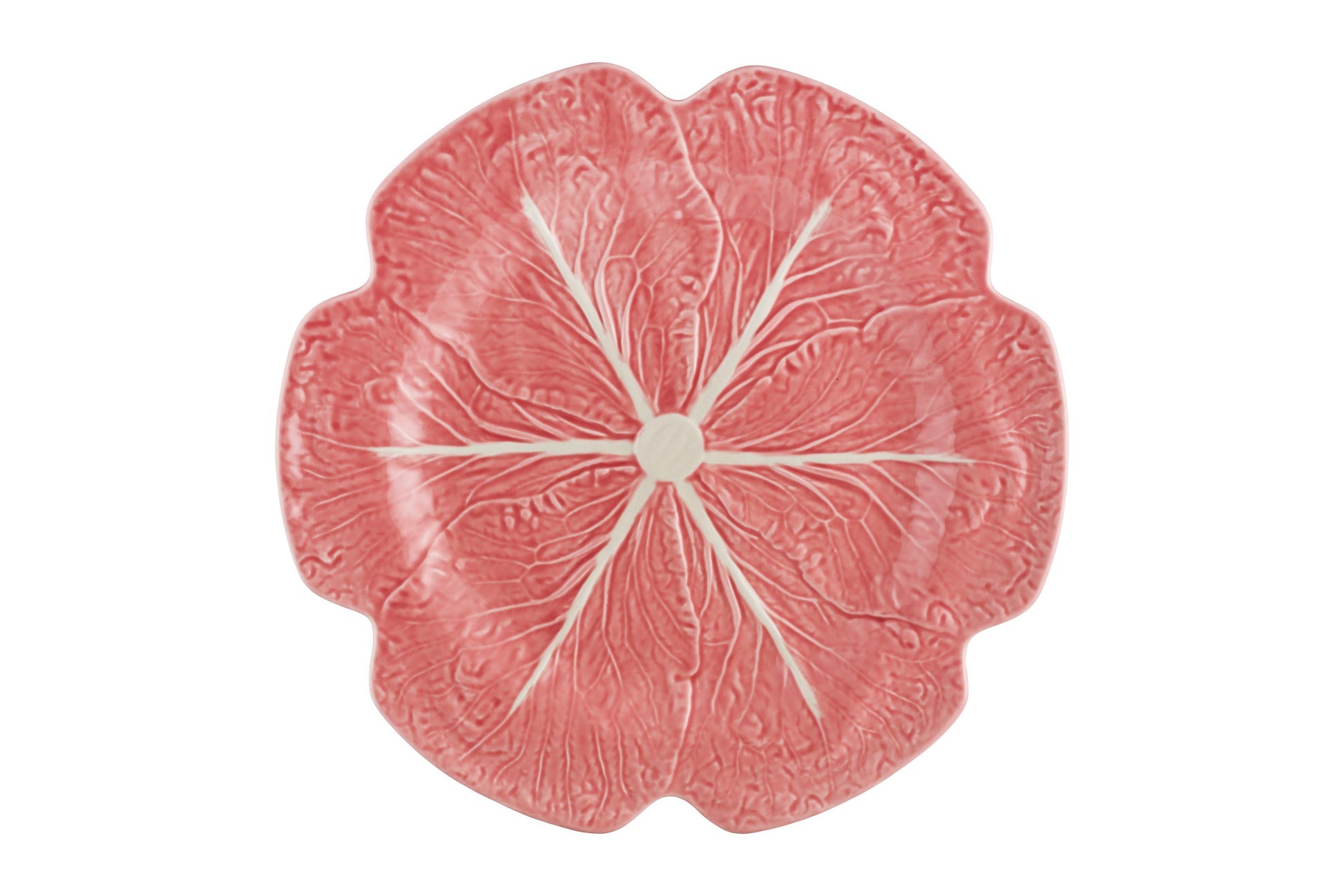 A pink ceramic plate from Hive’s Pink Cabbage Leaf Dinnerware and Serveware Collection, viewed from above—a playful nod to Raphael Bordallo Pinheiro’s iconic style.