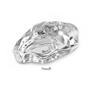 The Beatriz Ball Ocean Oyster Bowl Collection features a small, hand-polished silver dish with an organic oyster shell shape, beautifully displayed against a white background.