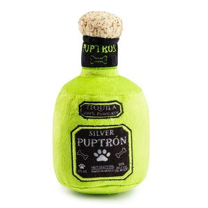 The Puptron Tequila Dog Toy from Haute Diggity Dog is a green plush dog toy shaped like a tequila bottle, featuring the words “Puptron” and “Silver” on the label. It’s part of the playful Muttini Bar & Grill Collection.
