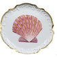 The Shell Bread and Butter Plate Collection by Anna Weatherley features white porcelain plates with gold-trimmed edges and a hand painted pink scallop shell centerpiece, inspired by Anna Weatherley’s classic style.