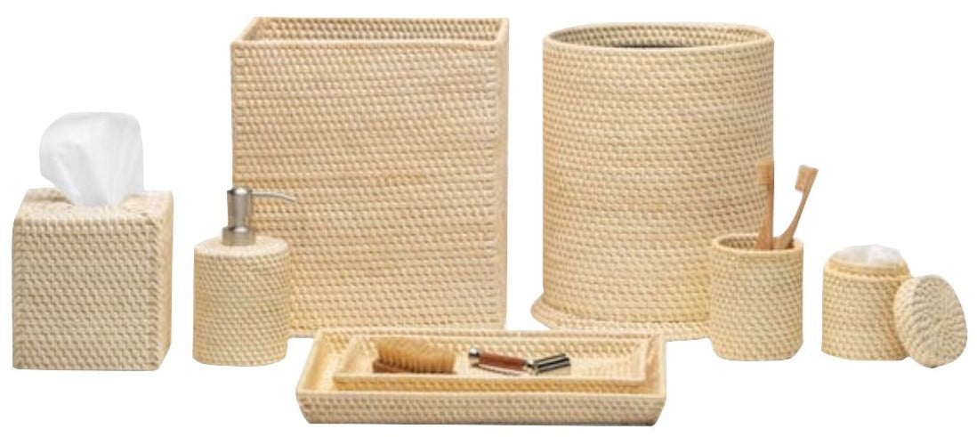 The Dalton Bath Collection by Pigeon & Poodle features handmade woven beige rattan accessories, including a tissue box, soap dispenser, waste bin, toothbrush holder, lidded container, and tray with grooming tools.