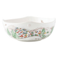 The Berry & Thread North Pole Dinnerware and Serveware Collection by Juliska features a white ceramic bowl with hand-painted village scenes—houses, trees, mountains, and a pond—ideal for holiday layering or pairing with reindeer Christmas tableware.