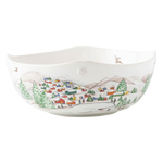 The Berry & Thread North Pole Dinnerware and Serveware Collection by Juliska features a white ceramic bowl with hand-painted village scenes—houses, trees, mountains, and a pond—ideal for holiday layering or pairing with reindeer Christmas tableware.