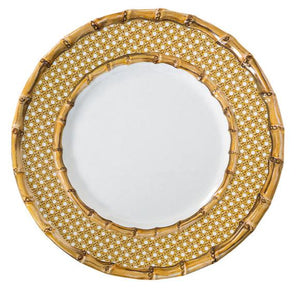 The Juliska Bamboo Caning Melamine Dinnerware Collection features a round plate with a white center, bamboo border, and gold lattice, crafted from shatterproof melamine for durability and elegance.