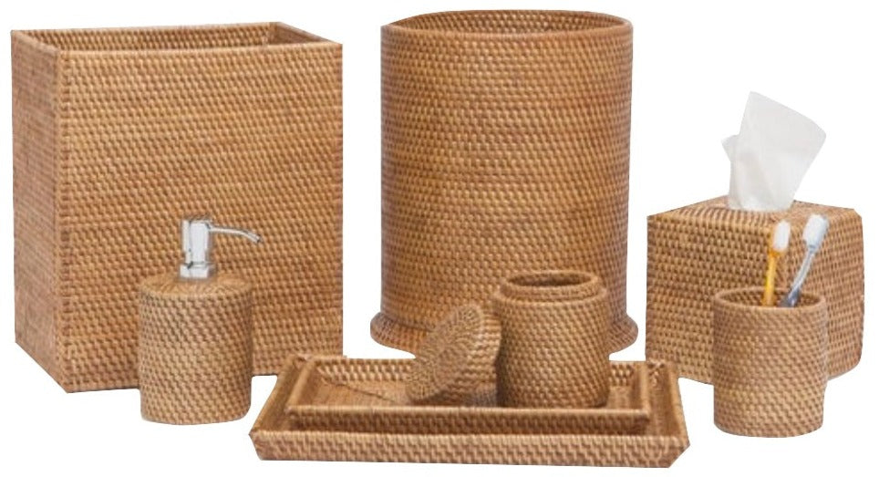 The Dalton Bath Collection by Pigeon & Poodle features six handmade rattan accessories—wastebasket, tissue box cover, soap dispenser, tray, lidded jar, and cup with toiletries—crafted using organic dyes and fine detail.