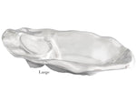 The Beatriz Ball Ocean Oyster Champagne Bucket Collection features large, polished aluminum oyster shell-shaped pieces with a shiny finish—ideal for serving champagne or as elegant centerpieces.