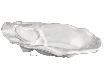 The Beatriz Ball Ocean Oyster Champagne Bucket Collection features large, polished aluminum oyster shell-shaped pieces with a shiny finish—ideal for serving champagne or as elegant centerpieces.