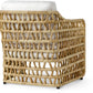 Thea Lounge Chair Natural by PALECEK features woven natural rattan in an open grid design with white upholstered seat and back cushions, shown from the back angle.