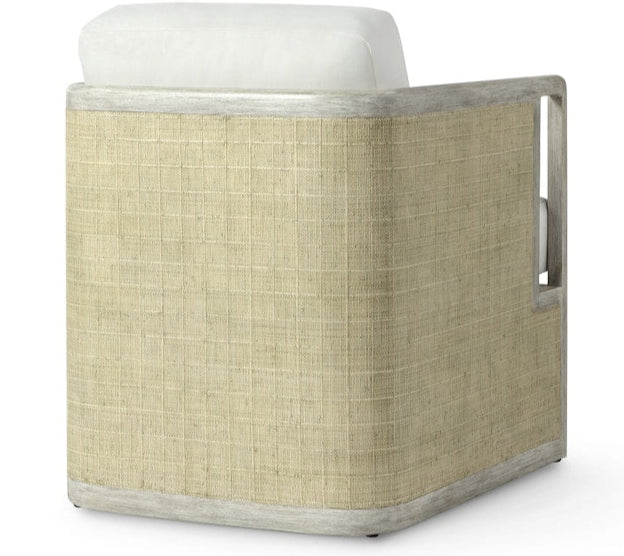 The Aveline Lounge Chair by PALECEK features a hardwood frame, woven rattan paneling on the back and sides, and a white upholstered cushion.