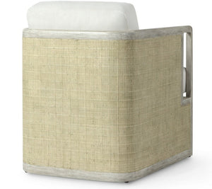 The Aveline Lounge Chair by PALECEK features a hardwood frame, woven rattan paneling on the back and sides, and a white upholstered cushion.