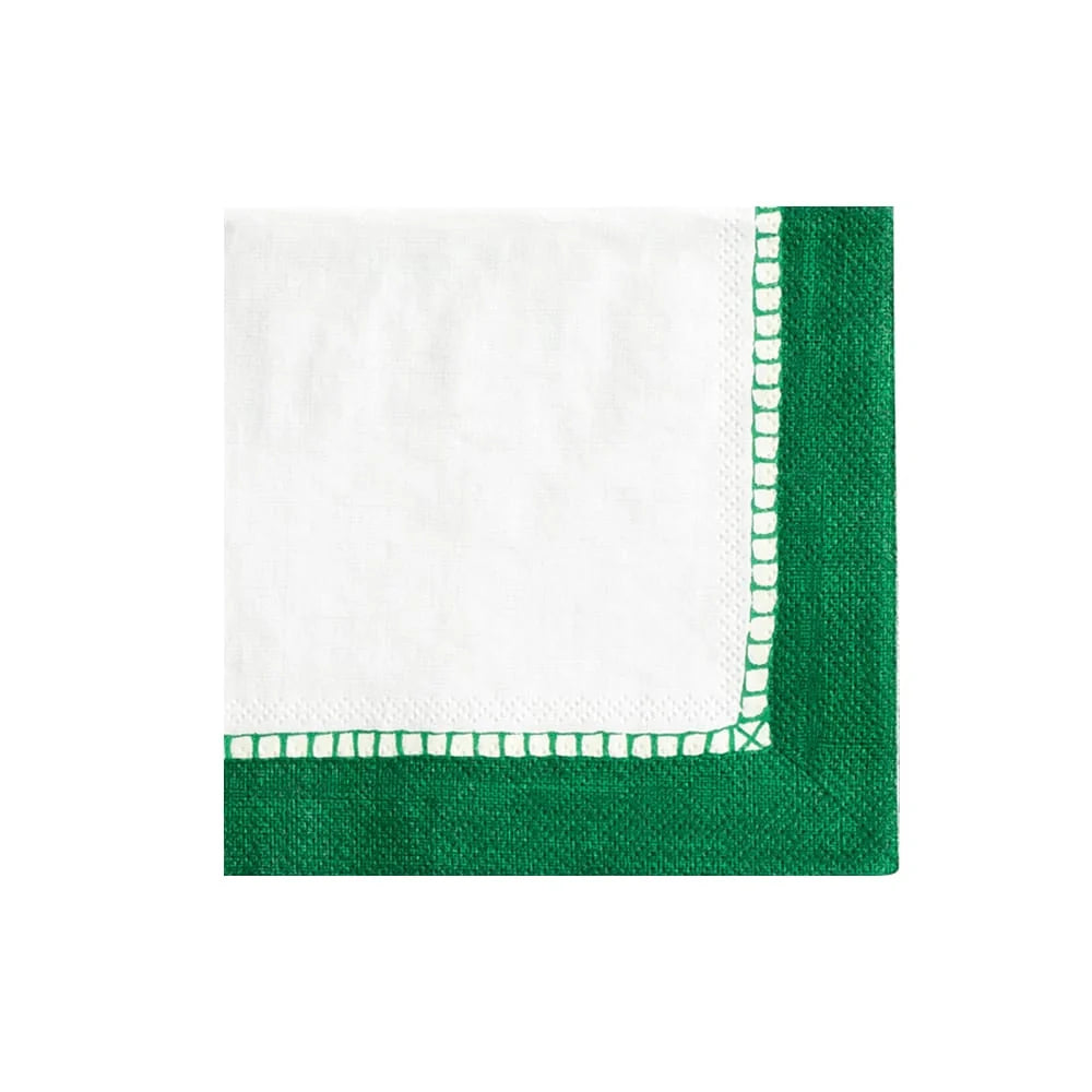 The Caspari Linen Border in Emerald napkin features a white, triple-ply design with a green border and inner decorative stitching, shown on a white background.