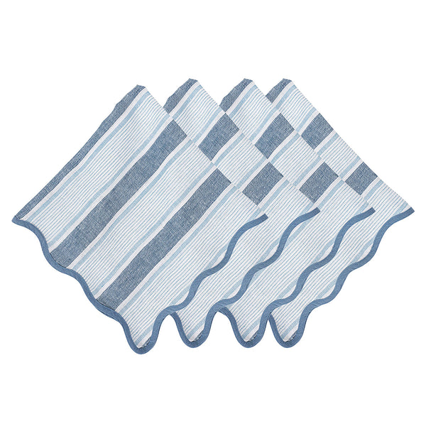 Four blue and white cloth napkins with scalloped trim from the Juliska Cabana Stripe Tabletop Collection, arranged neatly.
