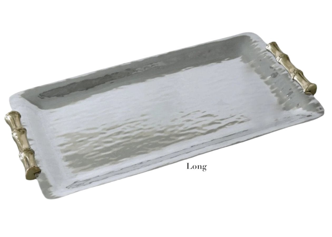 The Beatriz Ball Garden Bamboo Rectangular Tray features a hammered silver aluminum finish and gold bamboo-style handles. Both stylish and functional, this tray is part of the Garden Bamboo Tray Collection. “Long” is noted below the tray.