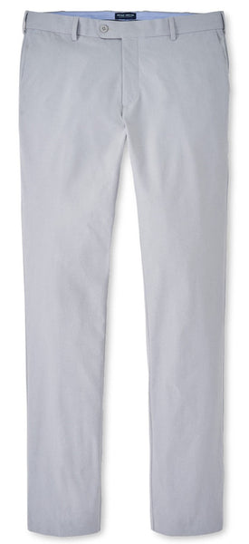 A pair of Peter Millar Surge Performance Trouser chinos with a button on the side, made with performance fabric.