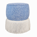The Amanda Stool by Hickory Chair features double rounded tiers for added dimension, showcasing a blue and white animal print upholstery on top with a long white fringe skirt around the bottom. Presented against a plain white backdrop as seen in the Hive Trade Showroom, this designer’s delight is sure to make a statement.