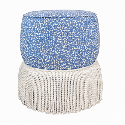 The Amanda Stool by Hickory Chair features double rounded tiers for added dimension, showcasing a blue and white animal print upholstery on top with a long white fringe skirt around the bottom. Presented against a plain white backdrop as seen in the Hive Trade Showroom, this designer’s delight is sure to make a statement.