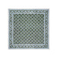 Square scarf featuring a green base, blue and black floral motifs, and a blue-white ornate border, inspired by SLOANE BY HAND’s Alwar Table Linen Collection’s elegant hand block printed linens.