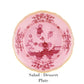 The Ginori 1735 Oriente Italiano Porpora Dinnerware Collection features a pink and red floral salad/dessert plate with scalloped yellow-trimmed edges, showcasing Italian elegance on a white background. Text below: "Salad / Dessert Plate.
