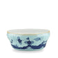 The Oriente Italiano Iris with Gold Dinnerware & Decor Collection by Ginori 1735 features a porcelain bowl with a scalloped rim, light blue base, gold trim, and dark blue floral and geometric patterns inspired by Faenza ceramics.