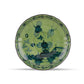 A round ceramic plate from the Ginori 1735 Oriente Italiano Malachite Dinnerware Collection, featuring a green and blue floral pattern with a decorative border, is viewed from above on a white background.