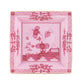 The Oriente Italiano Porpora square porcelain dish from Ginori 1735 features pink floral and lattice patterns, gold trim, and a central flowers-and-fence motif—a refined accent piece for your décor.