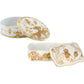 Two porcelain boxes from the Ginori 1735 Oriente Italiano Aurum Decor Collection—one round, one rectangular—feature gold floral designs and are shown with their lids partially open.