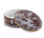 Round porcelain box from the Ginori 1735 Oriente Italiano Castagna Decor Collection, with a brown background and white floral patterns, plus a matching lid—an elegant accent for refined home decor.