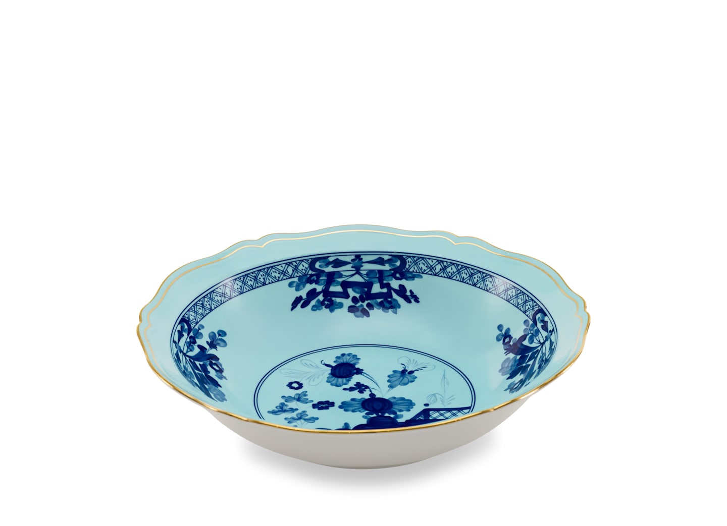 The Oriente Italiano Iris with Gold Dinnerware Bowl by Ginori 1735 features a scalloped edge, light blue interior, dark blue floral motifs, and a gold rim—reflecting refined Faenza ceramic style against a white background.