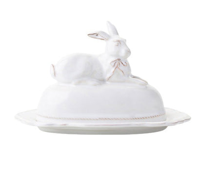 Part of Juliska’s Whitewash Bunny Serveware Collection, this elegant white butter dish features a rabbit-shaped lid resting on an oval ceramic base.