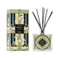A Nest Pierre Marie Birchwood Collection reed diffuser with a patterned glass bottle and black reeds, shown next to its matching decorative box.