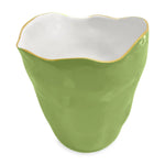 The ENCANTO Collection by Beatriz Ball features a green enamel ceramic cup with an uneven rim, white interior, and thin gold-toned edge accent.