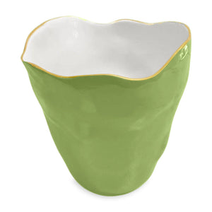 The ENCANTO Collection by Beatriz Ball features a green enamel ceramic cup with an uneven rim, white interior, and thin gold-toned edge accent.