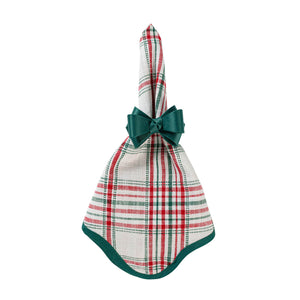 A festive, red, green, and white plaid Merry Tartan Napkin cinched with a dark green ribbon bow, perfect for holiday table linens.