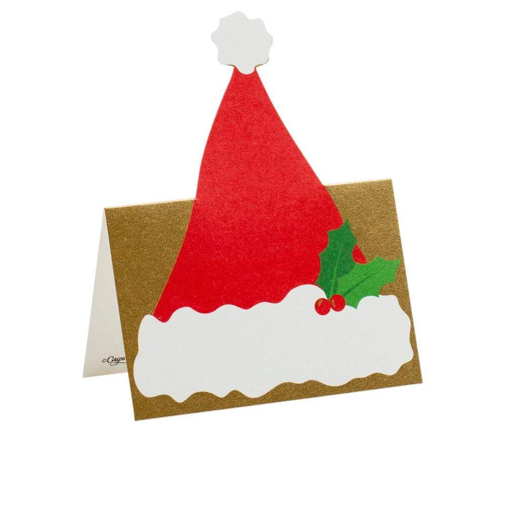 The Caspari Be Merry Collection features a gold greeting card with a red and white Santa hat and green holly on the front—perfect for holiday gift giving.