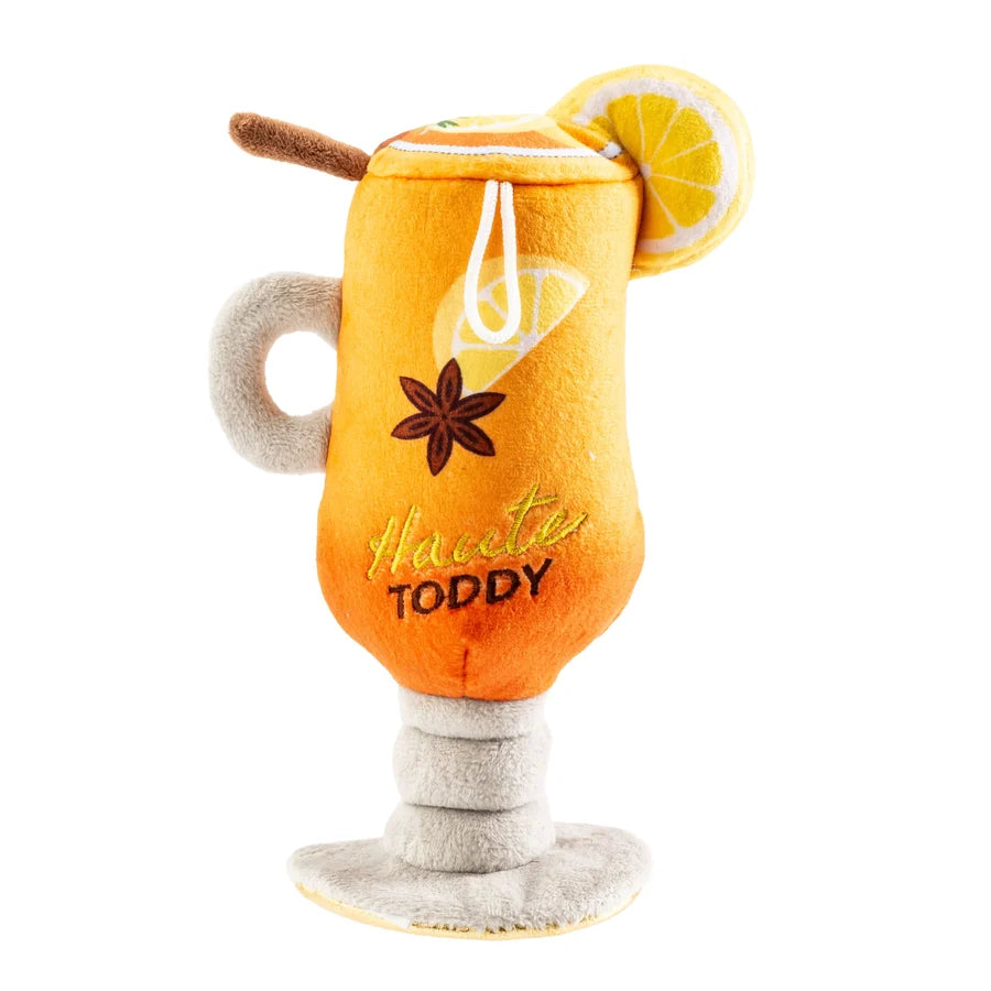 The Haute Diggity Dog “Haute Toddy” Dog Toy is a plush toy shaped like a hot toddy cocktail, complete with a lemon slice, cinnamon stick, star anise, and “Hot Toddy” embroidered on the front. This cozy plush mug features an interactive squeaker and makes the perfect après-ski toy for snuggly winter evenings.