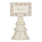 Off-white Berry & Thread Tree Place Card Holder in the shape of an evergreen tree with an embossed floral pattern, holding a card printed with the name Olivia.