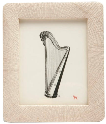 The Ancona Frame Collection by Pigeon & Poodle displays a harp illustration on white, accented by a small red dog icon in the corner—a subtle homage to Ancona.