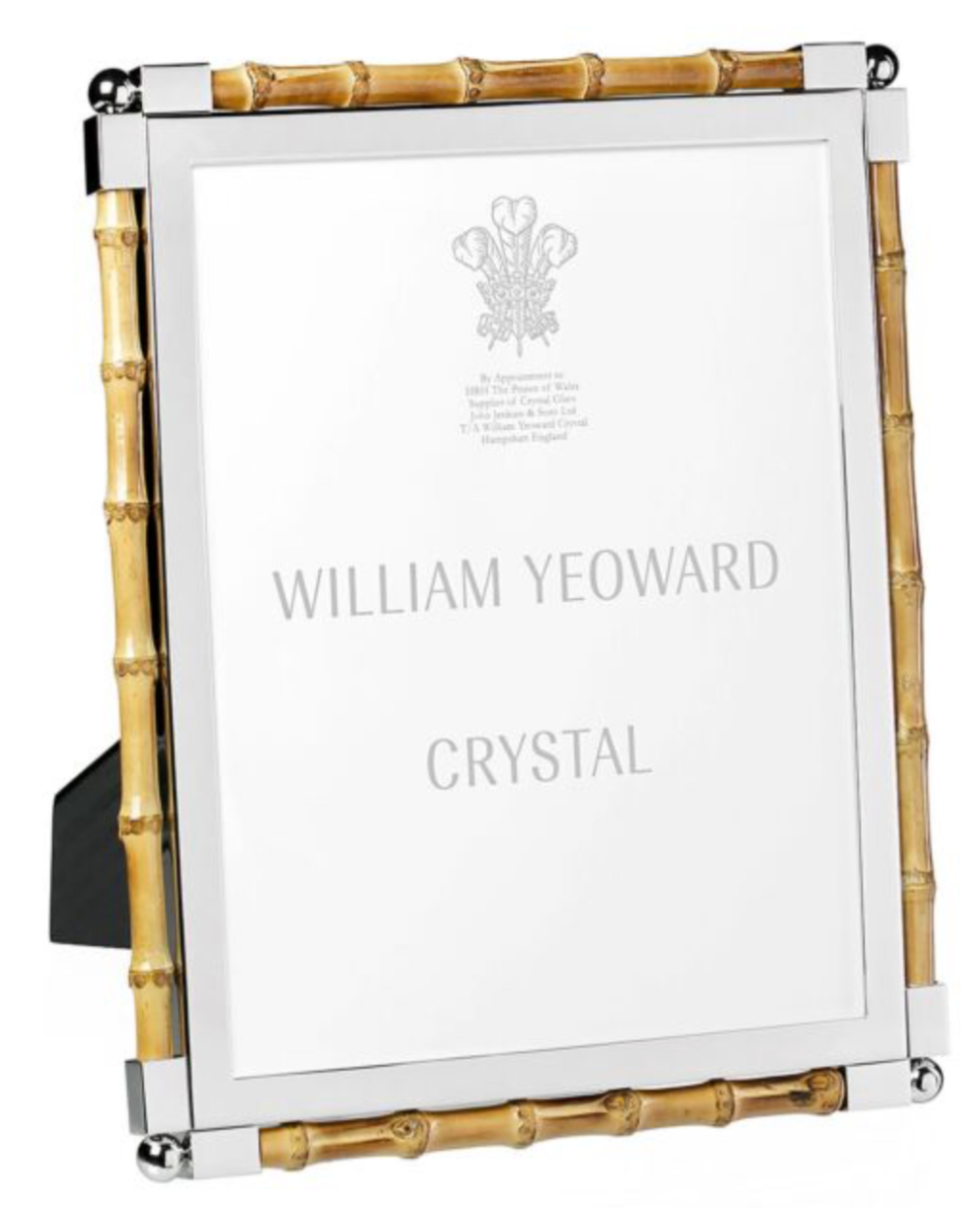The Bamboo Classic Frame Collection by William Yeoward Crystal is a chic rectangular bamboo photo frame with gold edges and nickel-plated silver corners—perfect for elevating your home décor.
