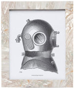 Black and white vintage diving helmet illustration centered on a white background, accented by the Aurora Frame Collection’s iridescent shell frame and textured pearlescent border from Pigeon & Poodle.