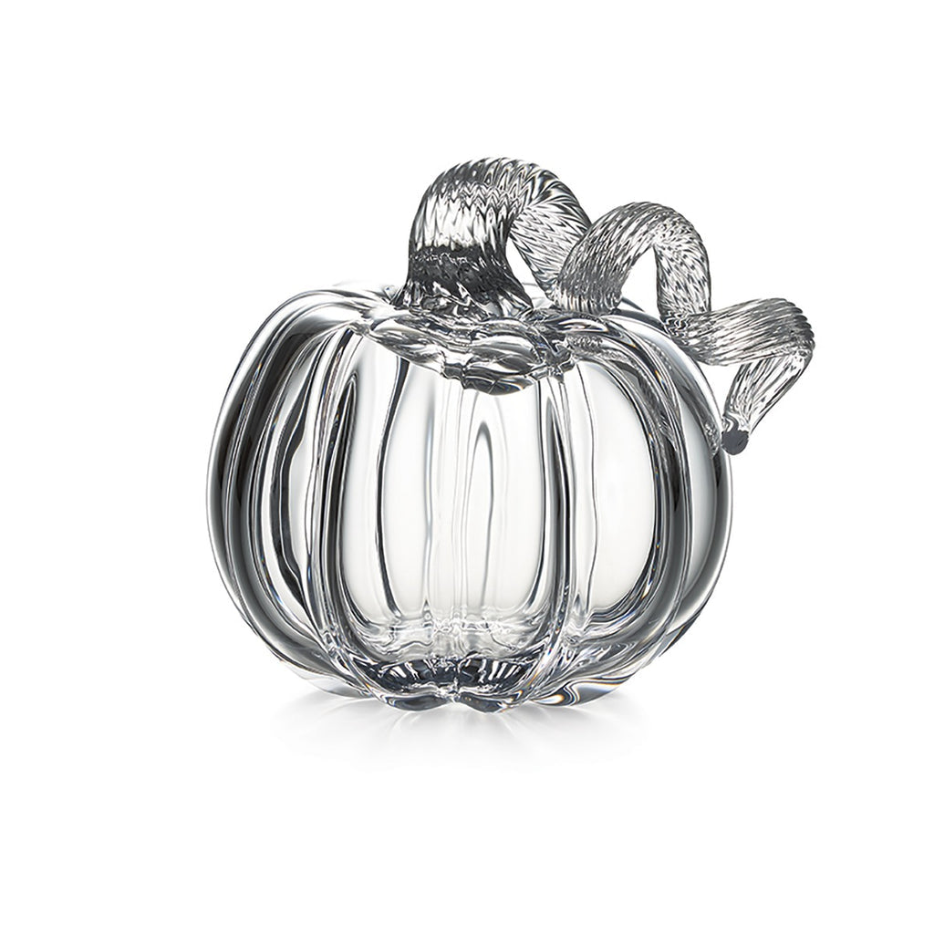 The Simon Pearce Glass Pumpkin with a Twist is a clear glass handmade sculpture, ideal for autumn decor or celebrating the New England harvest, shown on a white background.