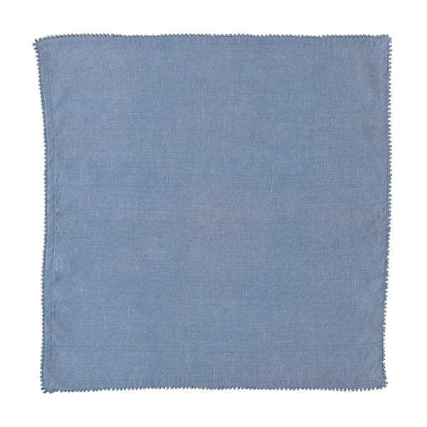 The Berry Trim Napkin Collection by Juliska features a square blue woven cotton napkin with subtle texture and a simple stitched border, shown on a white background.